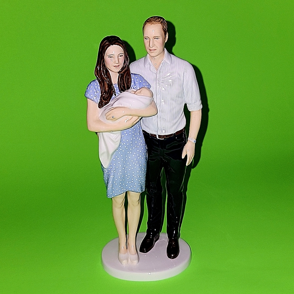 THE ROYAL BABY FIGURINE OF “PRINCE GEORGE” WITH PARENTS WILLIAM AND KATE